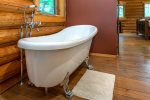 Relax and refresh in the master ensuite, featuring walk-in shower & claw foot bathtub.